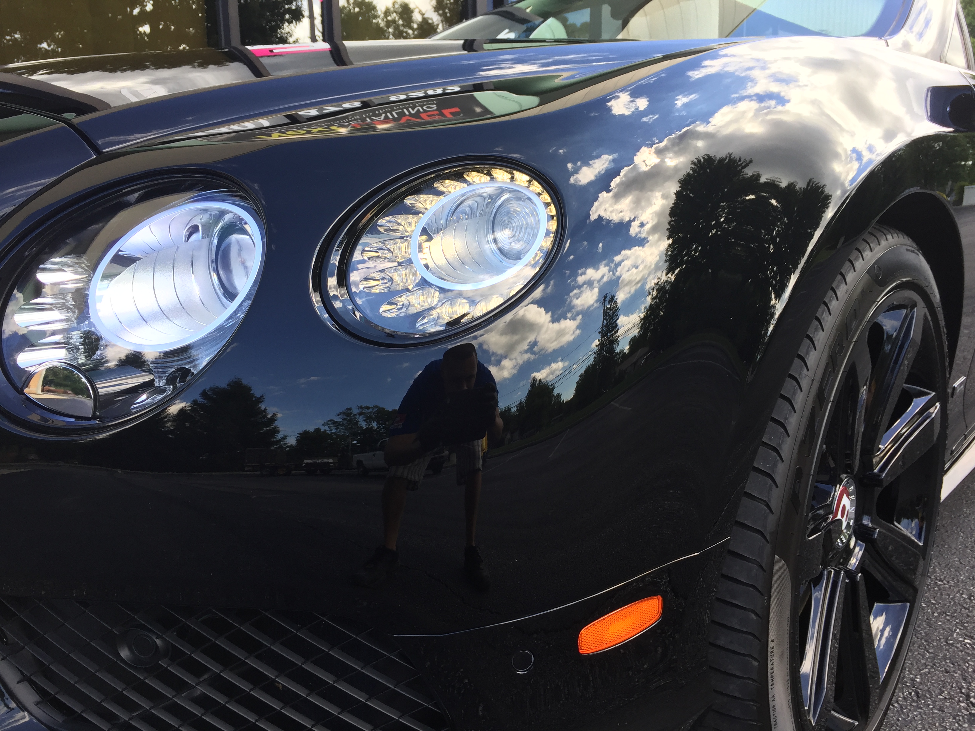 Bentley Continental GT — headlight and front fender detail close-up