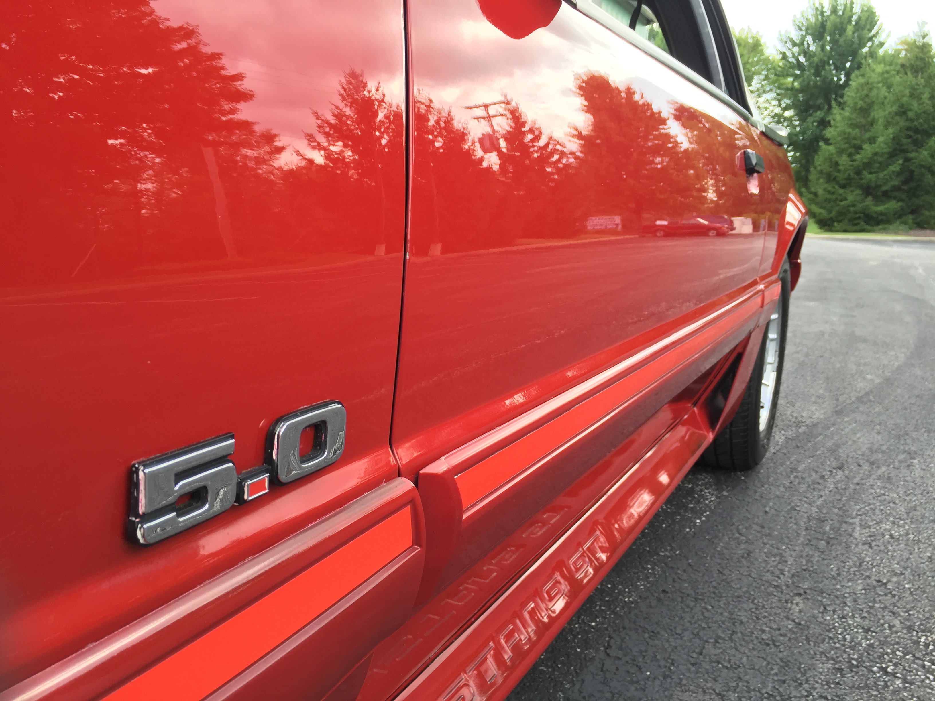 Fox Body Mustang GT 5.0 badge — mirror-finish paint after detail