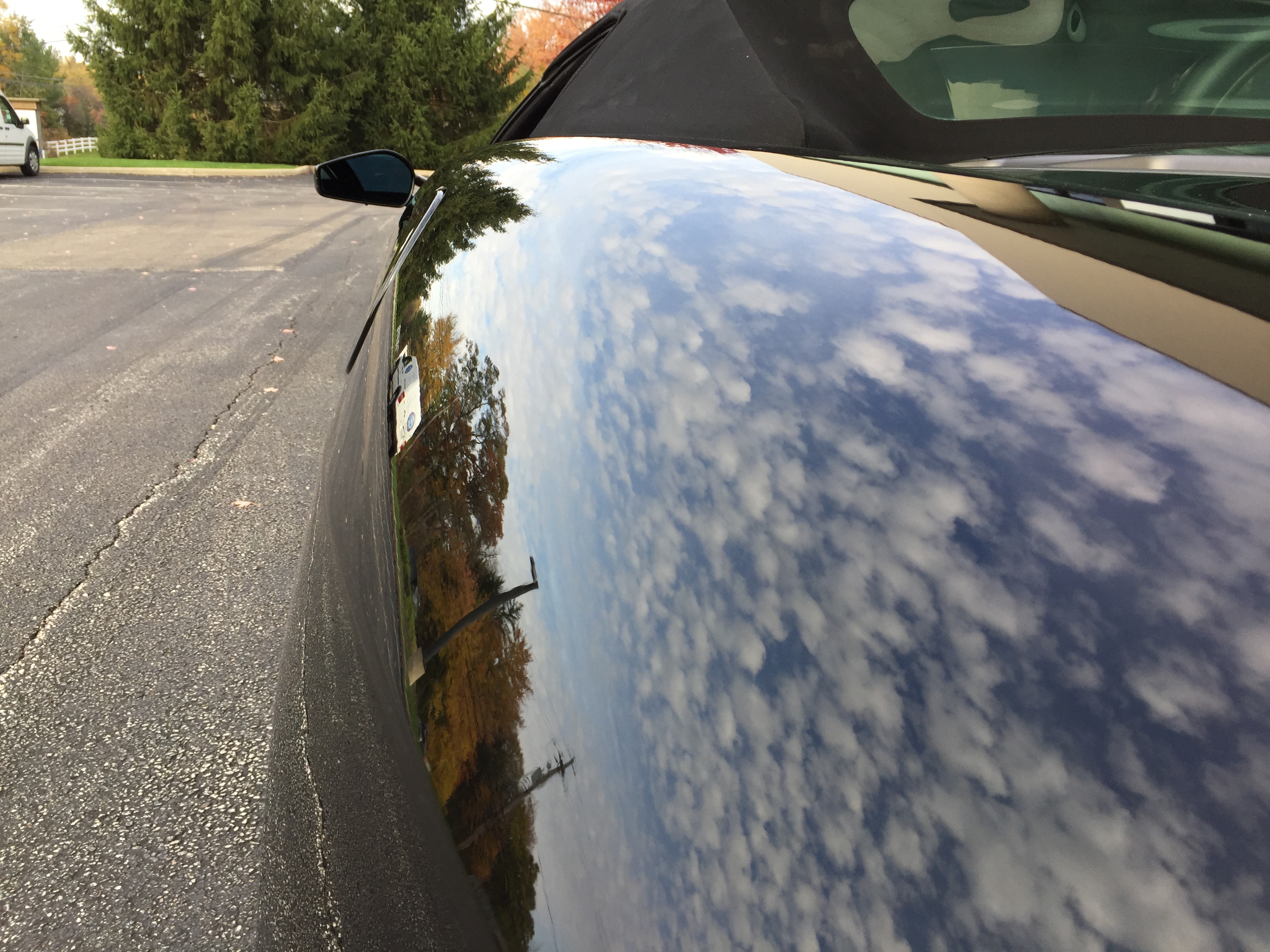 Ferrari F430 Spider — side panel reflection showcasing flawless paint correction