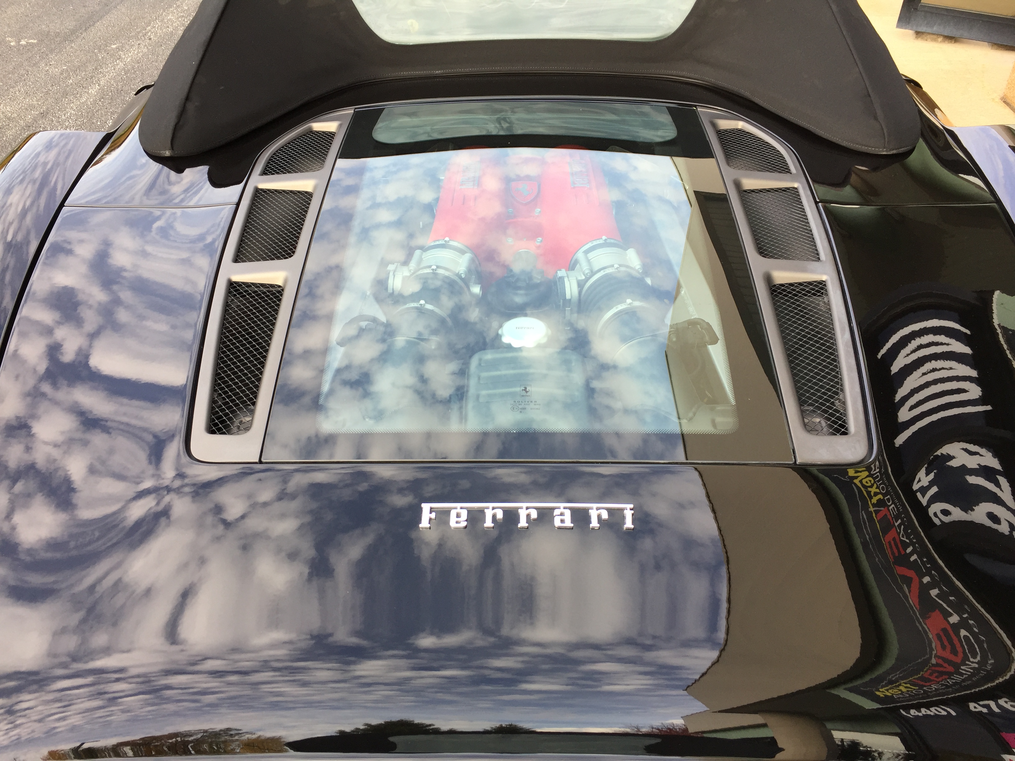 Ferrari F430 engine bay — flawless reflections after paint correction and ceramic coating